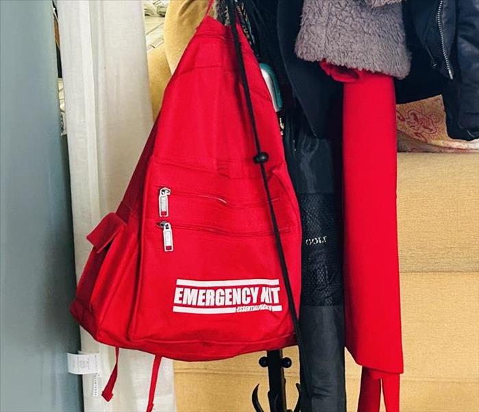 A to-go-bag on a coat rack.